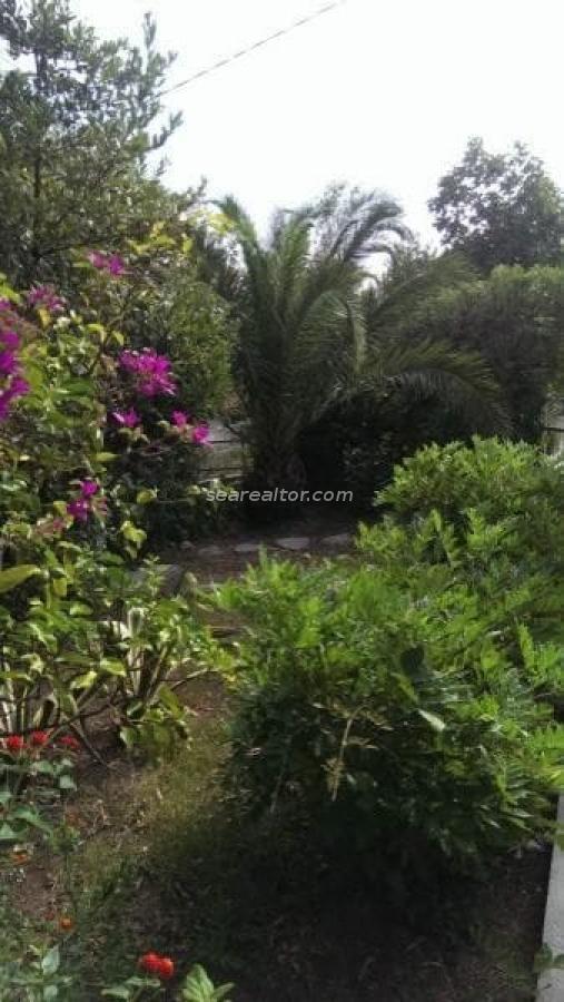 Building plot for sale on the seafront with two existing houses 4